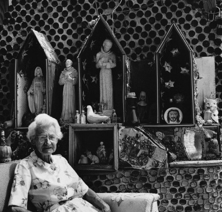 Tressa Grandma Prisbrey sits in her art environment in Simi Valley, California. Photo by Seymour Rosen.