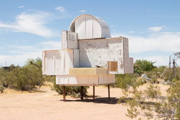 a white structure made of corrugated metal on four legs